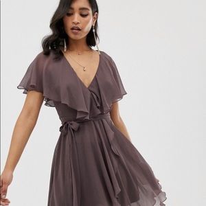 Mini dress with cape back and dipped hem